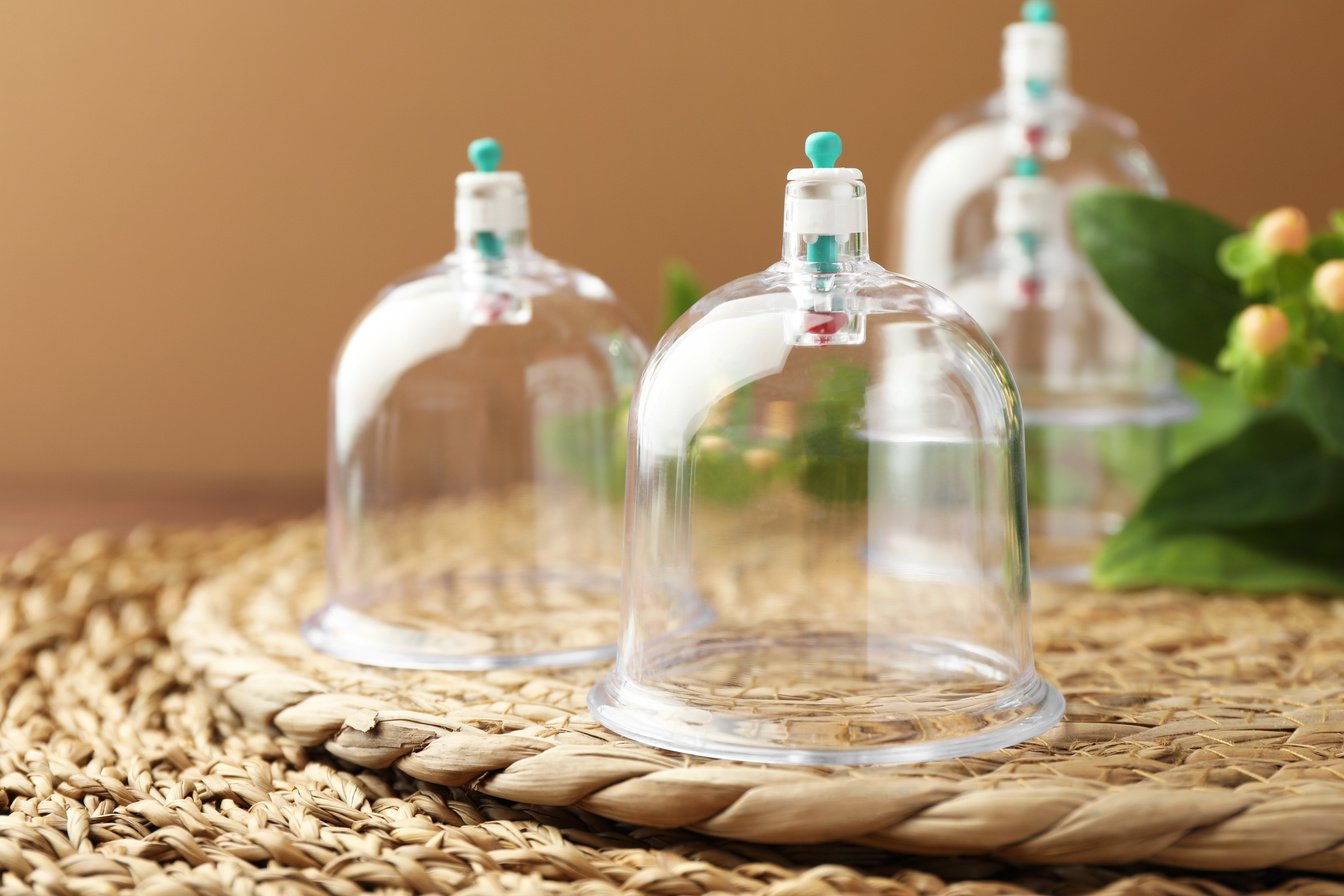 Cupping . Plastic Cup on Wicker Mat, Closeup